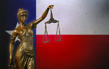 Texas flag with law statue