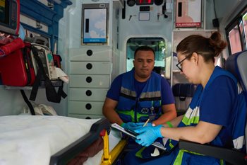 Two EMT/Paramedics charting patient information