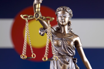 Colorado flag with statue of justice