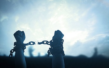 Image of wrist chains being broken