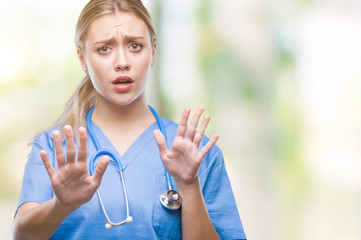 Nurse with hands up to stop patient violence.