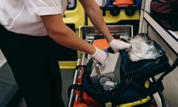 EMS provider looking through medical bag
