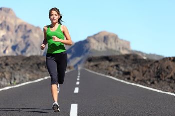 runner jogging down a long road