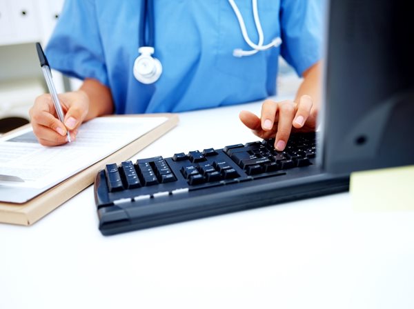 nurse working on a computer