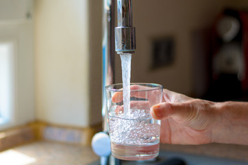 getting water from the tap