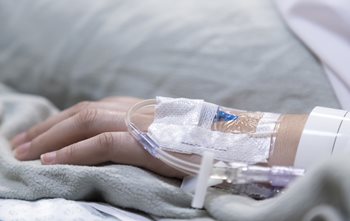 Peripheral IV in the hand of a patient