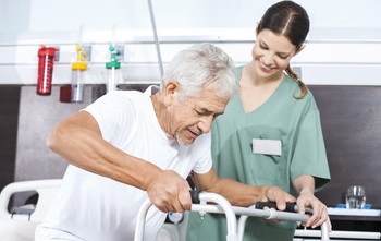 LTC nurse with resident using walker