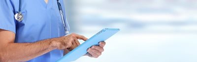 nurse working on a tablet