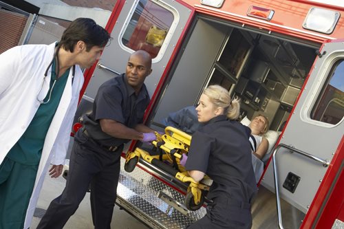 EMTs working at the back of an ambulance