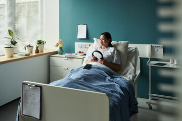 Hospital patient listening to music