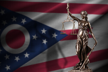 Ohio flag with gold judicial scales statue