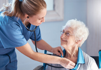 Nurse listening to the heart of an elderly resident with a stethoscope