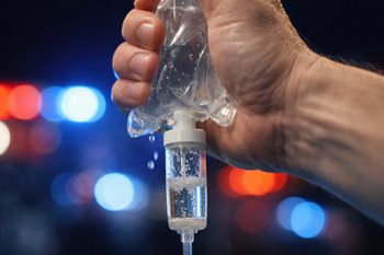 EMT pressure bagging an IV