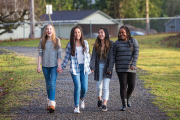 4 young teenage girls walking