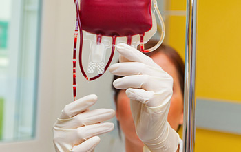 Nurse administering blood