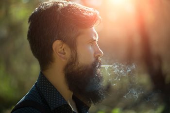 man with a beard, smoking